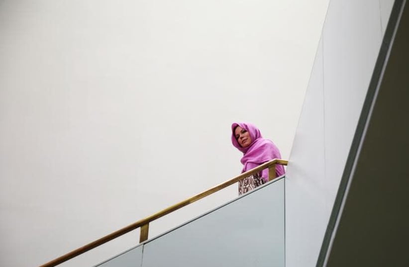 A Muslim American woman leaves the mosque after attending Friday "Jumaah" prayers at the Islamic Cultural Center of New York in New York City, New York, U.S., August 25, 2017 (photo credit: REUTERS/AMR ALFIKY)