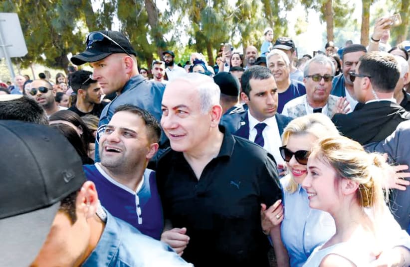 PRIME MINISTER Benjamin Netanyahu and his wife, Sara, join the public in the Wohl Rose Garden, opposite the Knesset, on Independence Day (photo credit: GPO)