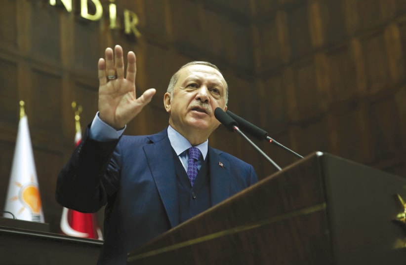 TURKISH PRESIDENT Tayyip Erdogan addresses members of the parliament from his AK Party in Ankara on April 24th, 2018.. (photo credit: MURAT CETINMUHURDAR/PRESIDENTIAL PALACE/REUTERS)