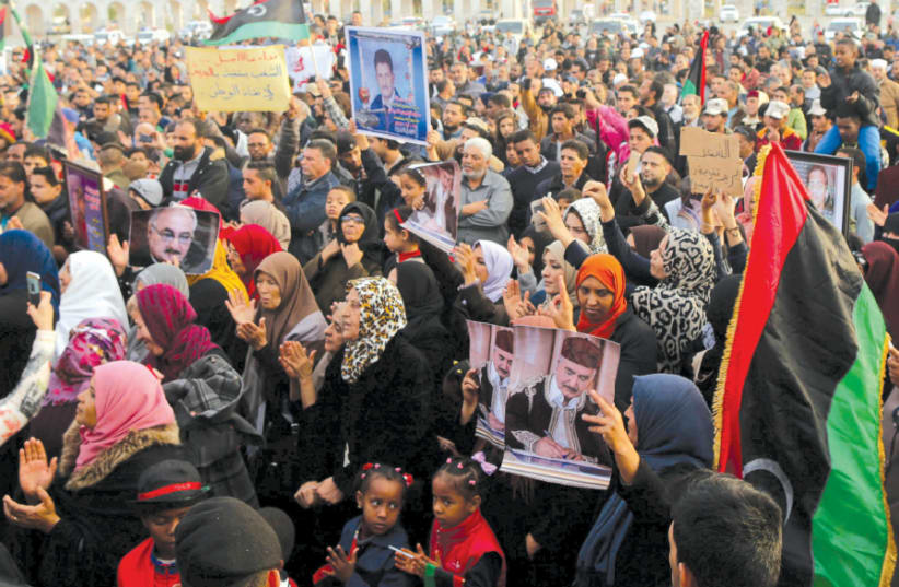 SUPPORTERS OF Eastern Libyan military commander Khalifa Haftar take part in a rally in Benghazi, Libya, calling for Haftar to take over after a UN deal for a political solution missed what they said was a self-imposed deadline in December 2017 (photo credit: REUTERS/ESAM OMRAN AL-FETORI)