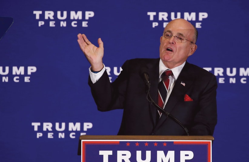 Rudy Guliani introduces Donald Trump to deliver remarks at a campaign event in Gettysburg in 2016 (photo credit: REUTERS)