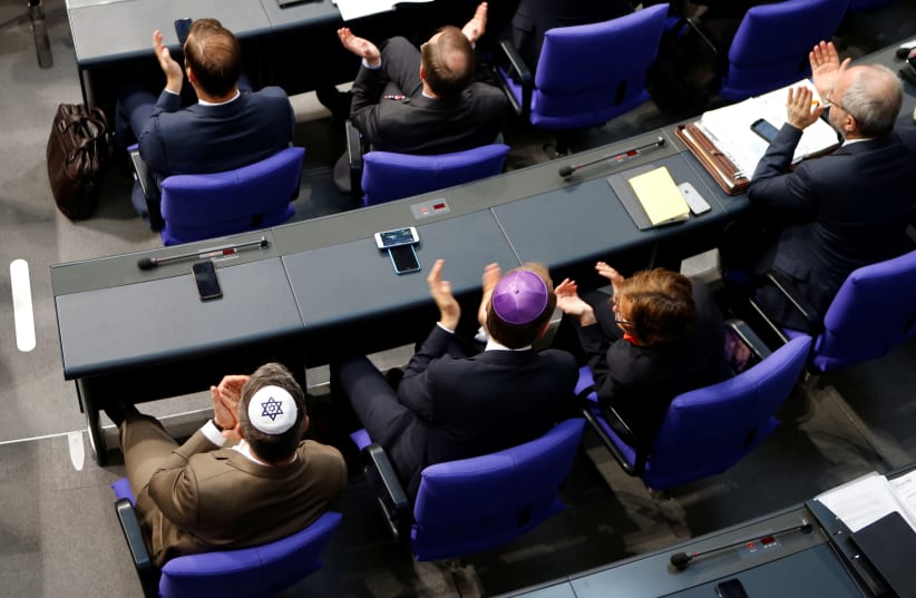 Members of the German parliament wearing kippas attend a session of the Bundestag in Berlin (photo credit: AXEL SCHMIDT/REUTERS)