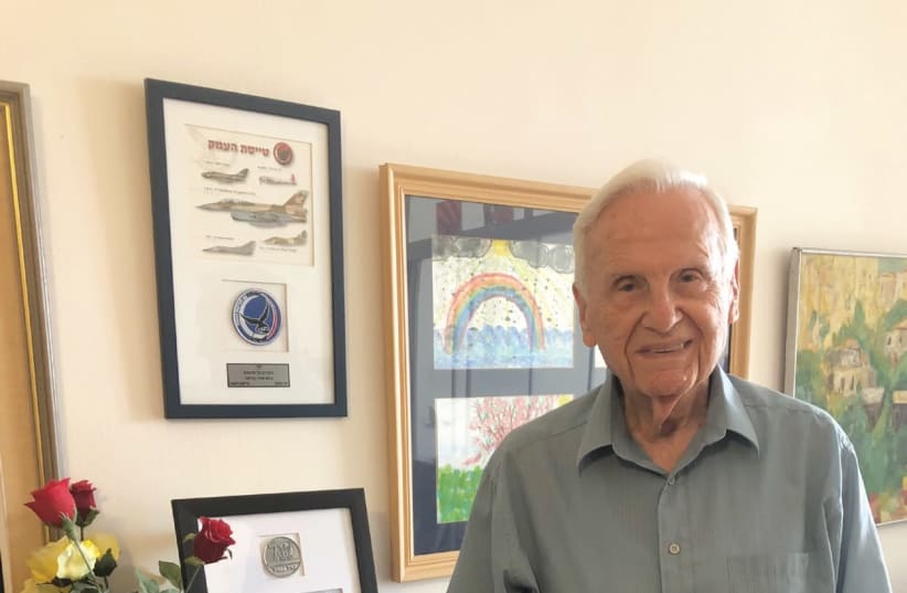DANNY SHAPIRA in his Haifa home, in front of certificates given by the IAF for his contributions to the state. (photo credit: ANNA AHRONHEIM)