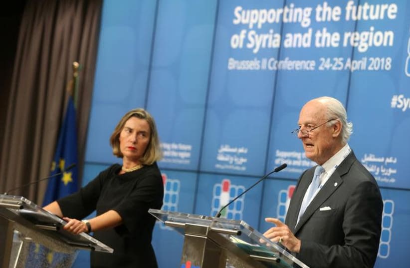 European Union foreign policy chief Federica Mogherini and United Nations Special Envoy for Syria Staffan de Mistura address a news conference during an international conference on the future of Syria and the region, in Brussels, Belgium, April 25, 2018.  (photo credit: REUTERS/FRANCOIS WALSCHAERTS)
