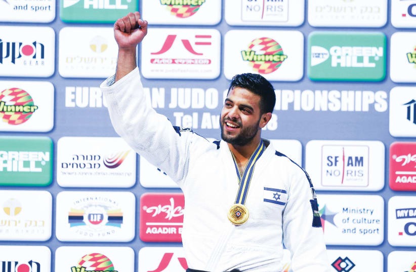 Israeli judoka Sagi Muki celebrates with his gold medal after winning the under-81kg event at the European Judo Championships in Tel Aviv (photo credit: DANNY MARON)
