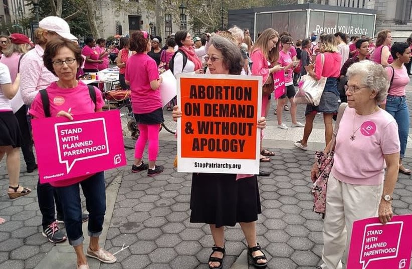 Planned Parenthood supporters and one anti-choice activist at a rally in New York (photo credit: Wikimedia Commons)