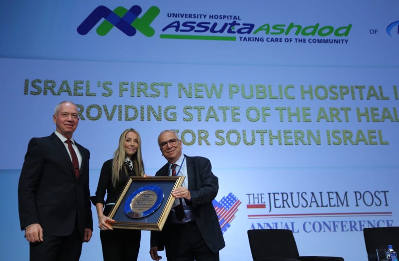 Prof. Joshua (Shuki) Shemer, MD, Chairman of the Board of Directors, Assuta Medical Centers Network receiving Assuta Prize by Minister of Construction Yoav Gallant and Jerusalem Post Group CEO Ronit Hassin-Hochman at the 7th Annual JPost Conference in NY (photo credit: MARC ISRAEL SELLEM)