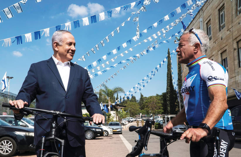 Israel Cycling Academy co-owner Sylvan Adams (right, with Prime Minister Benjamin Netanyahu) (photo credit: SHAHAR TZARFATI)