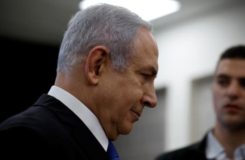 Israeli Prime minister Benjamin Netanyahu leaves the room after a news conference at the Ministry of Defence in Tel Aviv, Israel, April 30, 2018 (photo credit: REUTERS/AMIR COHEN)