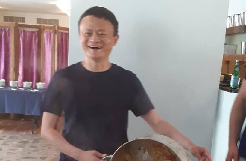 Alibaba chairman Jack Ma cooks up a batch of Mafrum while on a visit in Israel (photo credit: EUCALYPTUS RESTAURANT)
