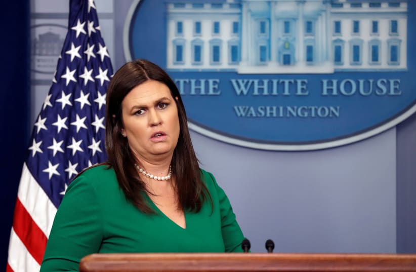 U.S. White House Press Secretary Sarah Huckabee Sanders holds the daily briefing at the White House in Washington, DC, U.S., April 9, 2018. (photo credit: CARLOS BARRIA / REUTERS)