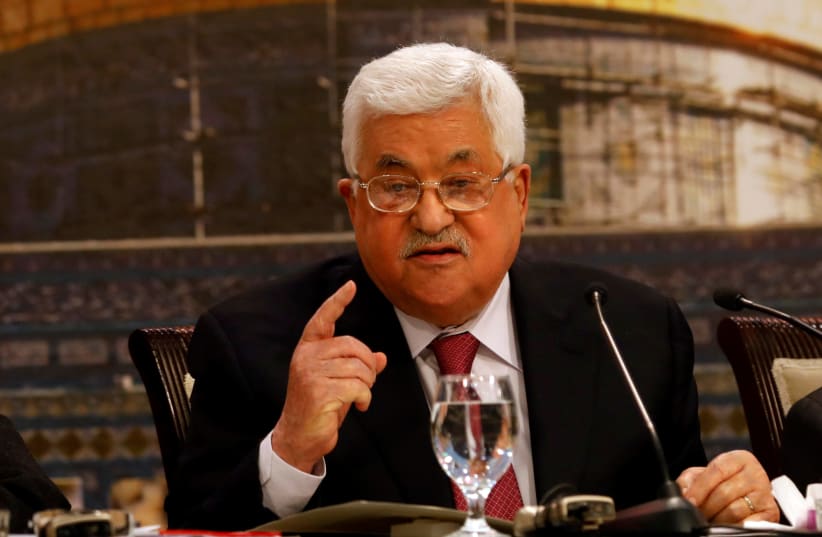 Palestinian President Mahmoud Abbas gestures as he speaks during the Palestinian National Council meeting in Ramallah (photo credit: MOHAMAD TOROKMAN/REUTERS)