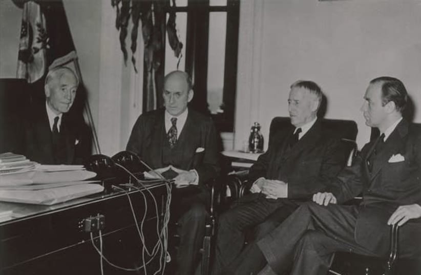 Third meetings of the Board of Directors of the War Refugee Board in the office of Secretary of State Cordell Hull. Pictured from left to right are: Cordell Hull, Henry Morgenthau, Henry L. Stimson, and John Pehle, Executive Director, March 21, 1944  (photo credit: VIA UNITED STATES HOLOCAUST MEMORIAL MUSEUM (COURTESY FRANKLIN D ROOSEVELT LIBRARY))
