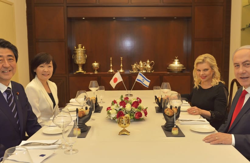 JAPAN’S PRIME MINISTER Shinzo Abe and his wife, Akie, sit down with Prime Minister Benjamin Netanyahu and his wife, Sara, in Jerusalem yesterday. (photo credit: KOBI GIDEON/GPO)