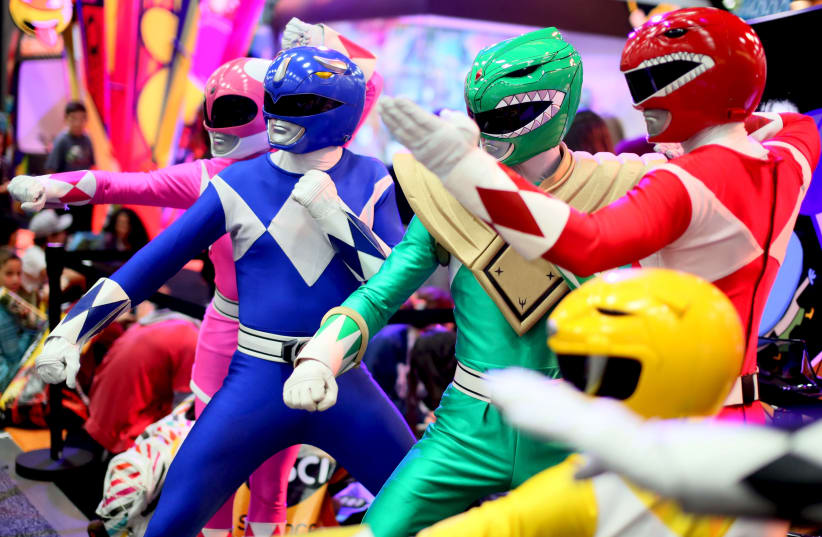 A group of Power Rangers pose inside the Convention Center at the 2015 Comic-Con International in San Diego, California July 9, 2015 (photo credit: REUTERS/SANDY HUFFAKER)