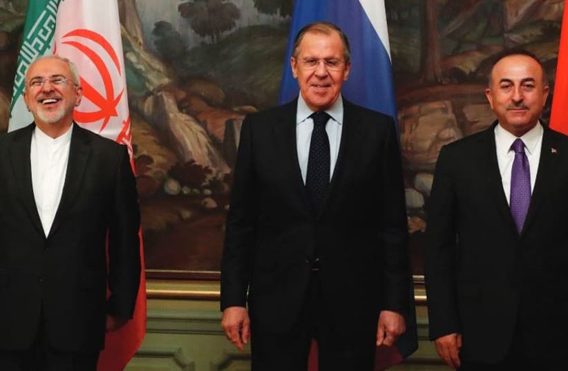 Foreign Ministers Mohammad Javad Zarif of Iran, Sergei Lavrov of Russia and Mevlut Cavusoglu of Turkey (photo credit: REUTERS)