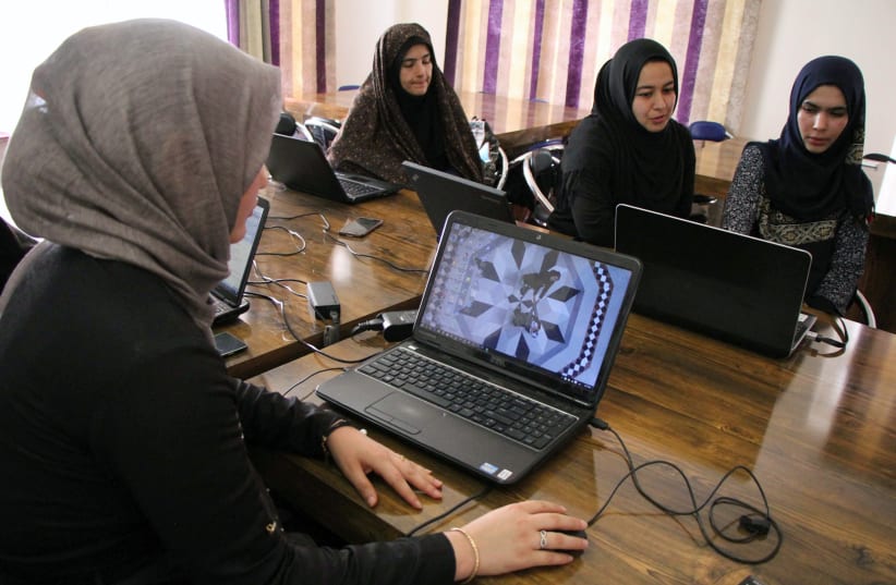Afghan coders practice at the Code to Inspire computer training center in Herat, Afghanistan April 24, 2018 (photo credit: REUTERS/ MOHAMMAD SHOIB)