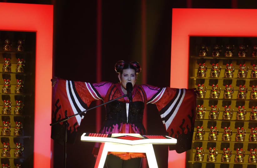 Israel’s Netta performs “Toy” during the Semi-Final 1 for Eurovision Song Contest 2018 in Lisbon (photo credit: PEDRO NUNES/REUTERS)