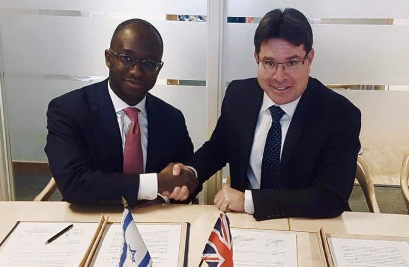 Science and Technology Minister Ofir Akunis (R) meets with UK Minister of State for Universities and Science Sam Gyimah (L), February 2018. (photo credit: Courtesy)