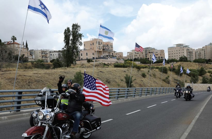 A biker rides near the new site of the US Embassy in Jerusalem (photo credit: REUTERS)