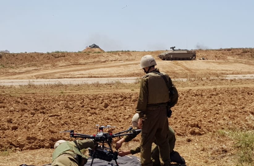 IDF soldiers prepare a drone for usage near the Gaza border, May 15th, 2018. (photo credit: ANNA AHRONHEIM)