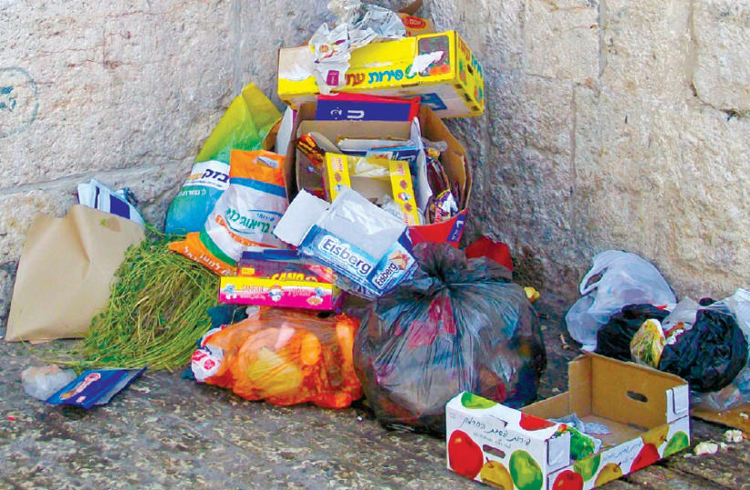 Garbage dumped in the Old City (photo credit: Wikimedia Commons)
