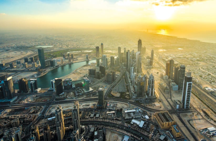 The view of downtown Dubai at sunset from the Burj Khalifa, the world’s tallest building (photo credit: Wikimedia Commons)