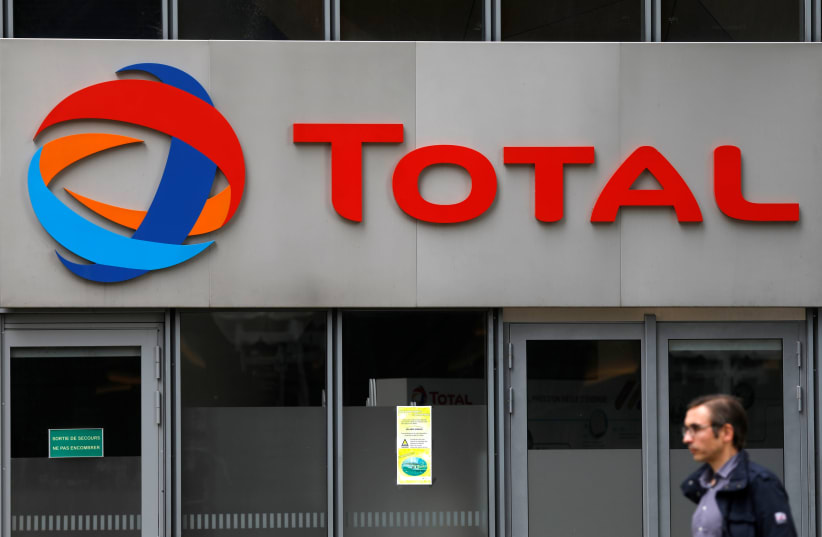 The logo of French oil giant Total is seen at La Defense business and financial district in Courbevoie, near Paris, France. May 16, 2018 (photo credit: REUTERS)