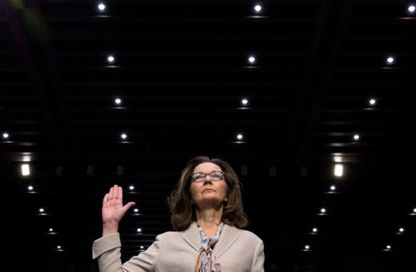  CIA director nominee and acting CIA Director Gina Haspel is sworn in to testify at her Senate Intelligence Committee confirmation hearing on Capitol Hill in Washington, US, May 9, 2018. (photo credit: AARON P. BERNSTEIN/ REUTERS)