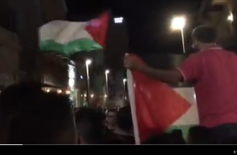 Protesters holding Palestinian flags in Haifa, Israel.  (photo credit: SOCIAL MEDIA)