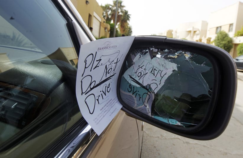 A note placed by an unknown person on female driver Azza Al Shmasani's car, is pictured in Saudi Arabia June 22, 2011. Saudi Arabia has no formal ban on women driving. But as citizens must use only Saudi-issued licences in the country, and as these are issued only to men, women drivers are anathema. (photo credit: FAHAD SHADEED/ REUTERS/ FILE PHOTO)