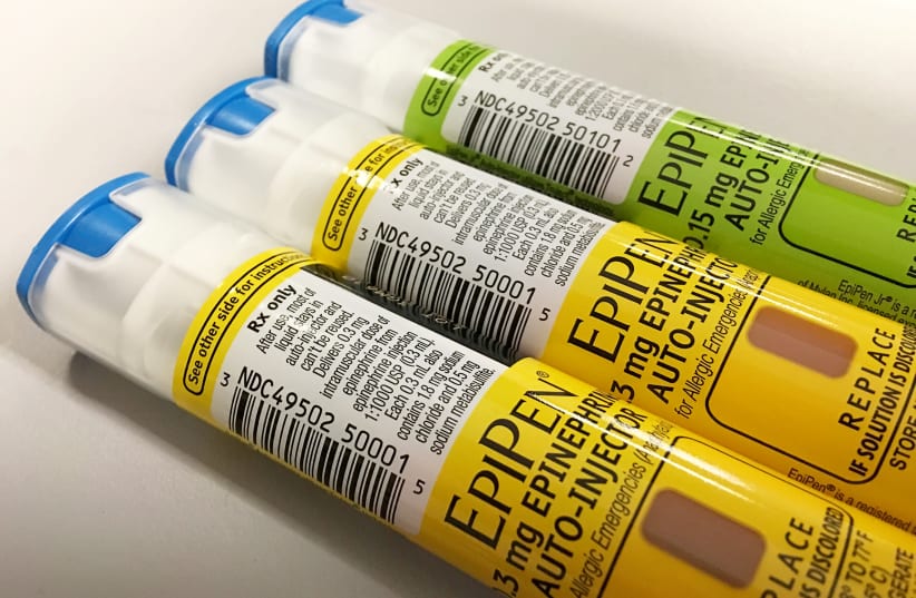 EpiPen auto-injection epinephrine pens manufactured by Mylan NV pharmaceutical company for use by severe allergy sufferers are seen in Washington, U.S. August 24, 2016.  (photo credit: JIM BOURG / REUTERS)
