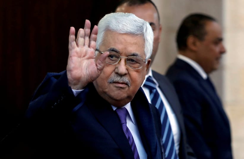 Palestinian President Mahmoud Abbas waves in Ramallah, in the West Bank May 1, 2018 (photo credit: REUTERS/MOHAMAD TOROKMAN)