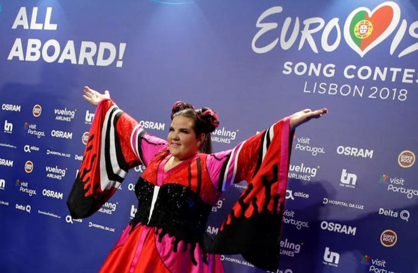 Israel's Netta arrives for the news conference after winning the Grand Final of Eurovision Song Contest 2018 at the Altice Arena hall in Lisbon, Portugal, May 13, 2018. (photo credit: REUTERS/PEDRO NUNES)