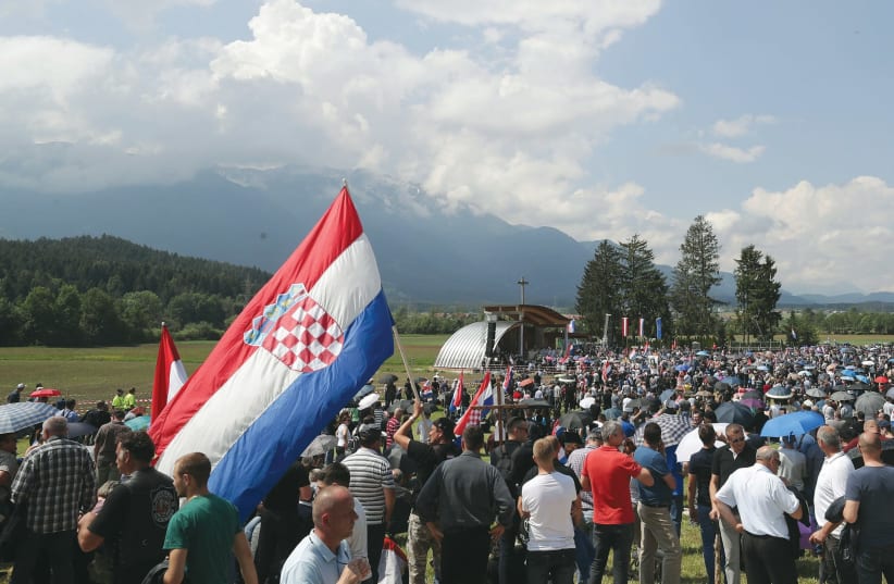 PARTICIPANTS TAKE part in a Catholic ceremony commemorating the turning away from Austria of pro-Nazi Croatians at the end of the Second World War. (photo credit: REUTERS)