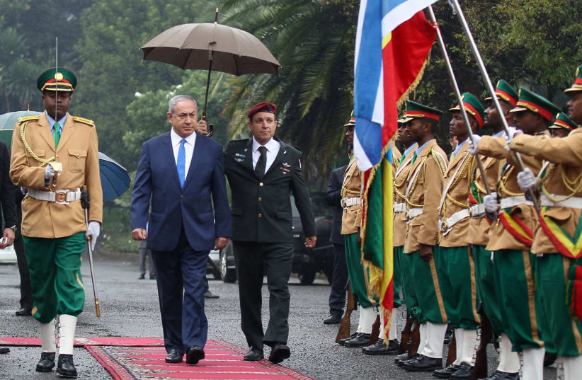 Israeli Prime Minister Benjamin Netanyahu inspects a guard of honor at the National Palace during his State visit to Addis Ababa, Ethiopia, July 7, 2016 (photo credit: REUTERS/TIKSA NEGERI)