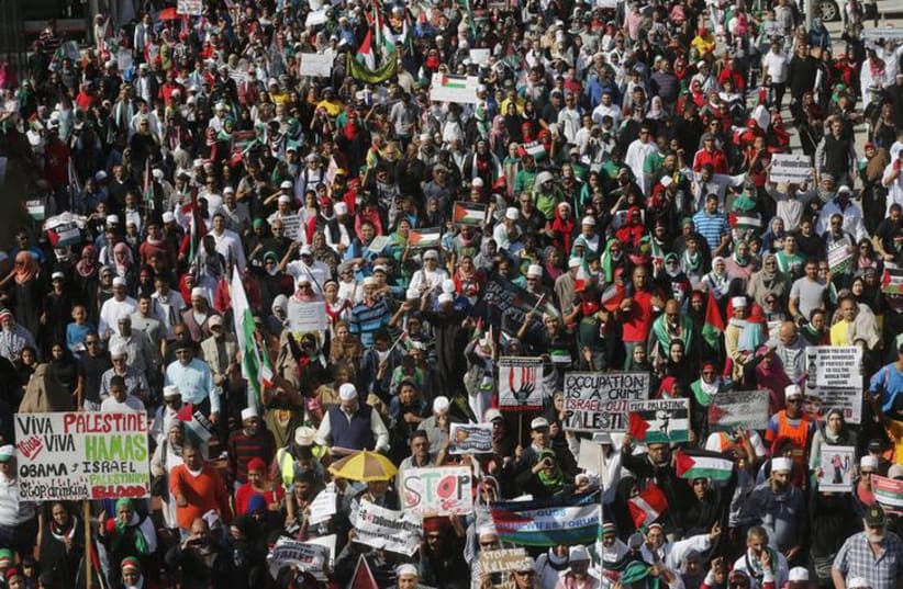 Demonstrators march through the streets of Cape Town against the Israeli-Palestinian conflict August 9, 2014 (photo credit: REUTERS/MIKE HUTCHINGS)