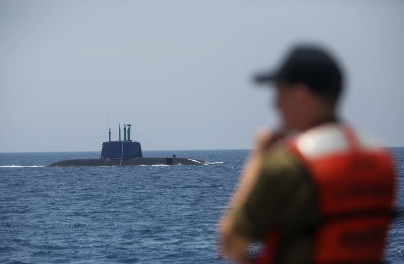 A soldier overlooks the Israeli navy's Dolphin-class submarine (photo credit: MARC ISRAEL SELLEM)