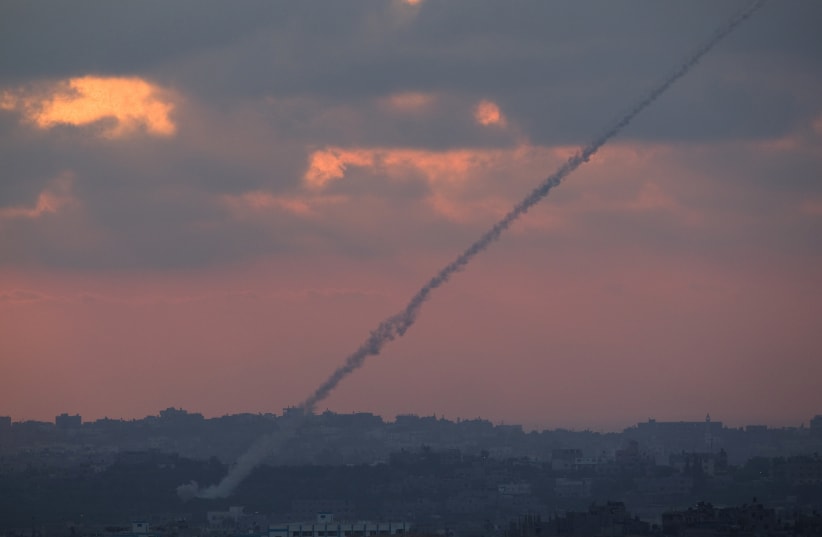 Smoke trails are seen as rockets are launched from the Gaza Strip towards Israel as seen from the Israeli border August 23, 2014 (photo credit: REUTERS/AMIR COHEN)
