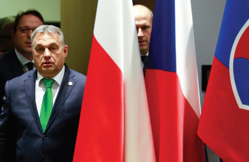 HUNGARY’S PRIME Minister Viktor Orban arrives for a Visegrad Group meeting in Brussels.  (photo credit: REUTERS)