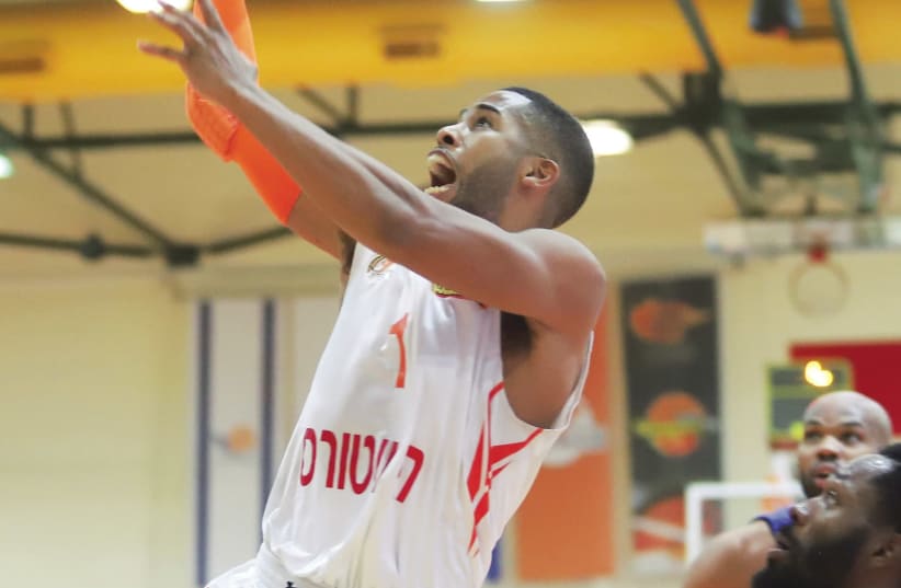 roni Ness Ziona guard Gary Browne scores two of his 10 points in last night’s 95-94 win over Maccabi Tel Aviv in Game 2 of their BSL quarterfinals playoff series. (photo credit: DANNY MARON)