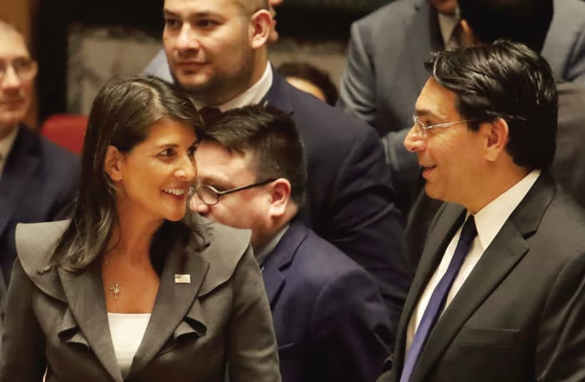 US AMBASSADOR to the UN Nikki Haley speaks with Israeli Ambassador Danny Danon before a Security Council vote on an Arab-backed resolution for protection of Palestinian civilians, at the UN headquarters on Friday. (photo credit: SHANNON STAPLETON/ REUTERS)