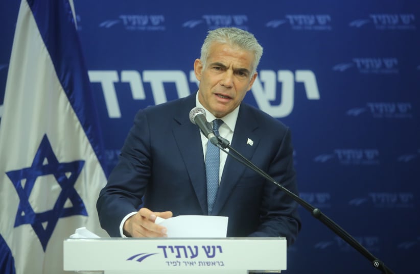 Yesh Atid leader Yair Lapid speaks at the weekly faction meeting at the Knesset (photo credit: MARC ISRAEL SELLEM/THE JERUSALEM POST)