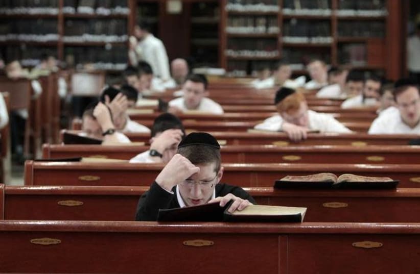 Ultra-Orthodox Jewish youths study religious texts at a synagogue in Jerusalem April 7, 2011.  (photo credit: BAZ RATNER/REUTERS)