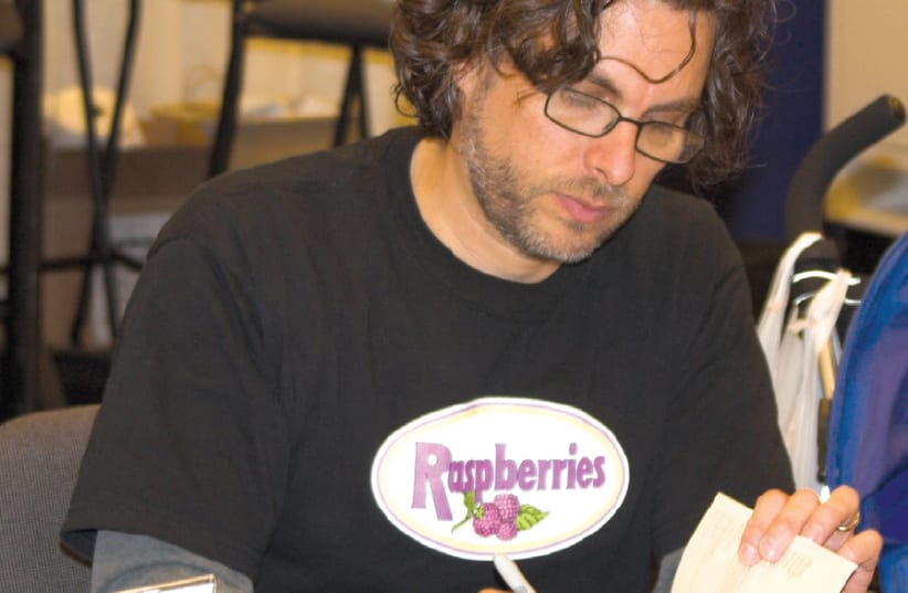 MICHAEL CHABON at a book signing at in 2006 (photo credit: Wikimedia Commons)