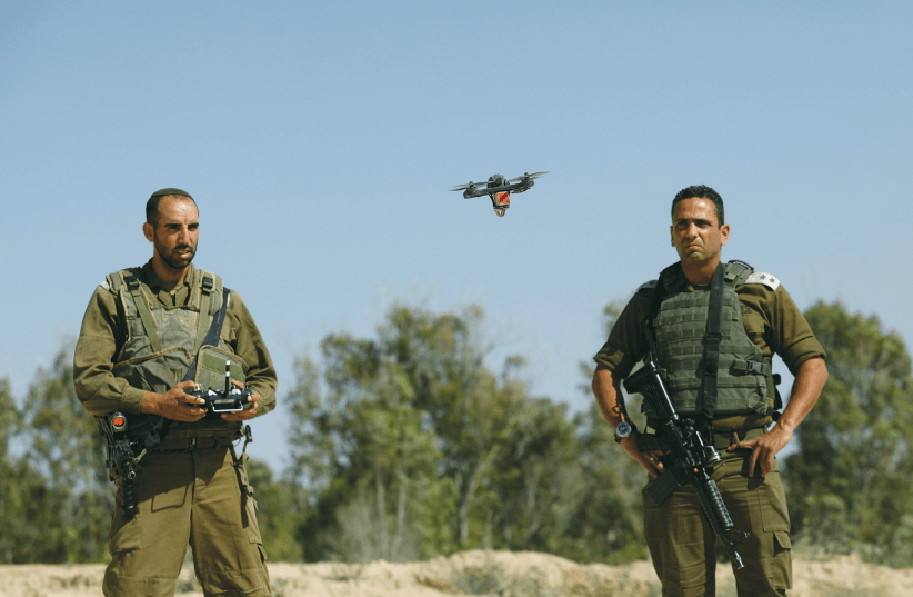 A DRONE FLOWN by IDF soldiers trying to intercept Palestinian kites and balloons loaded with flammable materials, is pictured near Kissufim Tuesday. (photo credit: AMIR COHEN/REUTERS)