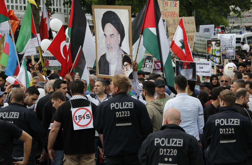 Demonstrators attend an 'al-Quds Day' protest rally in Berlin, Germany, July 11, 2015 (photo credit: FABRIZIO BENSCH / REUTERS)