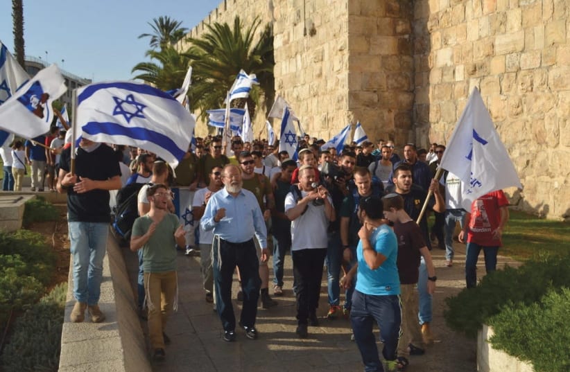 Rabbi Eli Sadan, left, and marching with students outside the Old City in Jerusalem (photo credit: BARRY DAVIS)