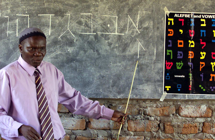 Ugandan Rabbi Harun Kintu Moses conducts a Hebrew language lesson at Hadassah School, a jewish community institute in Mbale some 224km east of Uganda's capital Kampala. Ugandan Rabbi Harun Kintu Moses conducts a Hebrew language lesson at Hadassah School, a Jewish community institute in Mbale along t (photo credit: REUTERS)