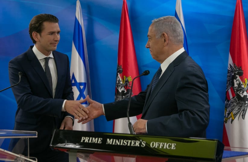 Prime Minister Benjamin Netanyahu (R) shakes hands with Austrian Chancellor Sebastian Kurz (L) during a meeting on June 11, 2018 (photo credit: OHAD TZVEIGENBERG‏/POOL)
